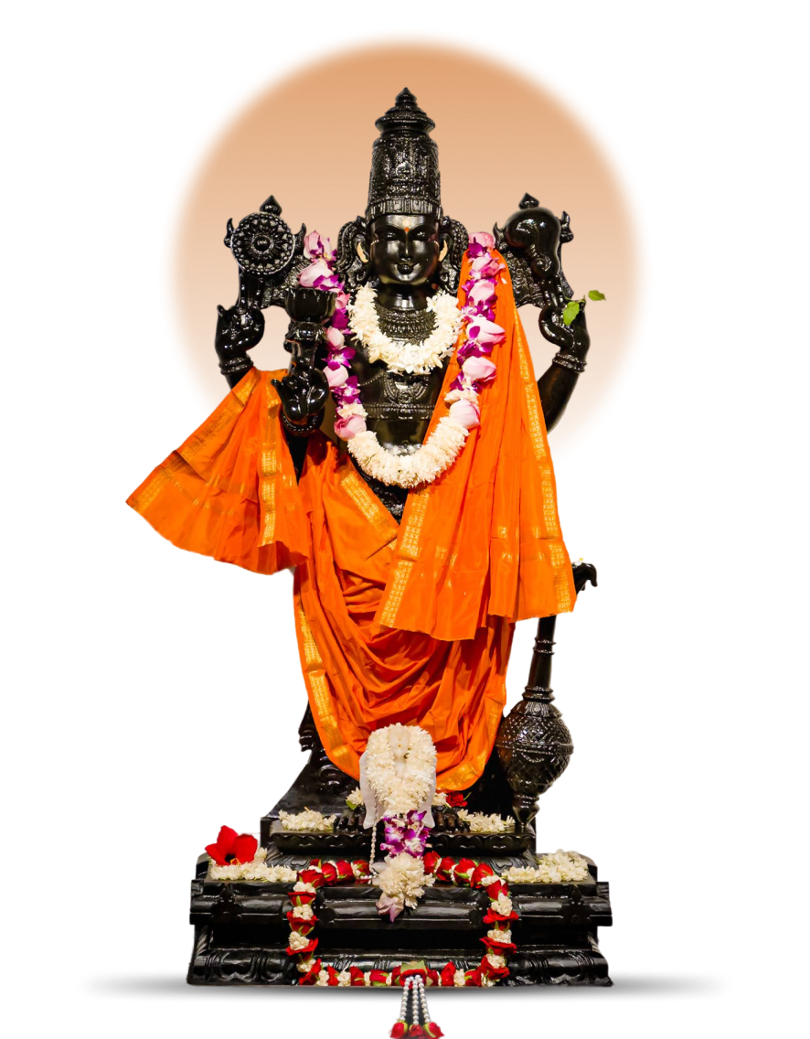 The consecrated idol of Sri Hari, adorned with garlands and saffron silk